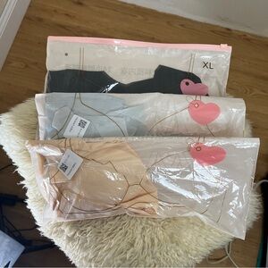(3) NWT BRAS BOYGHT OFF FACEBOOK. NO Brand. Size XL. Pull on-no hooks. Nylon